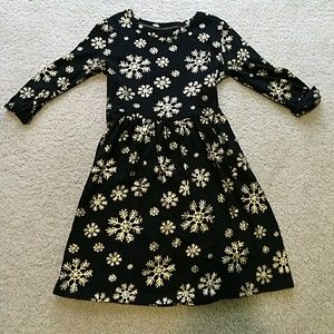Girls black dress with gold snowflakes